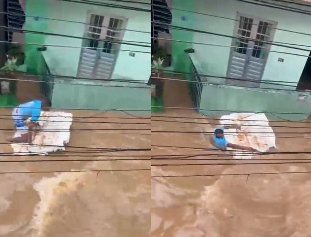 Homem é arrastado por correnteza em rua alagada durante fortes chuvas no Recife em destaque